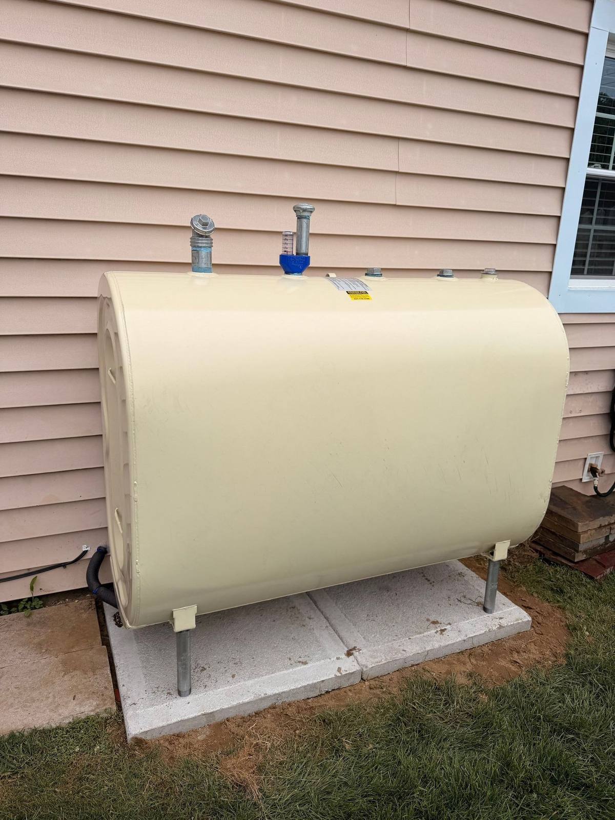 New above-ground oil tank installation at a Levittown NY house